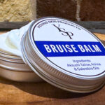 Natural grass-fed organic bruise balm by Young Skin Products, a chemical-free remedy with Akauashi Tallow, Arnica, and Calendula Oils.